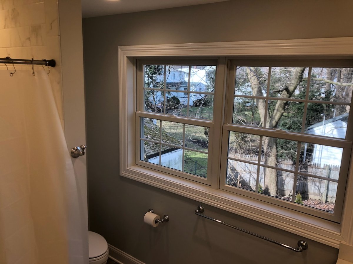 Bathroom renovation featuring large windows in a Ridgewood, NJ project by Fairmount Heights Homes.