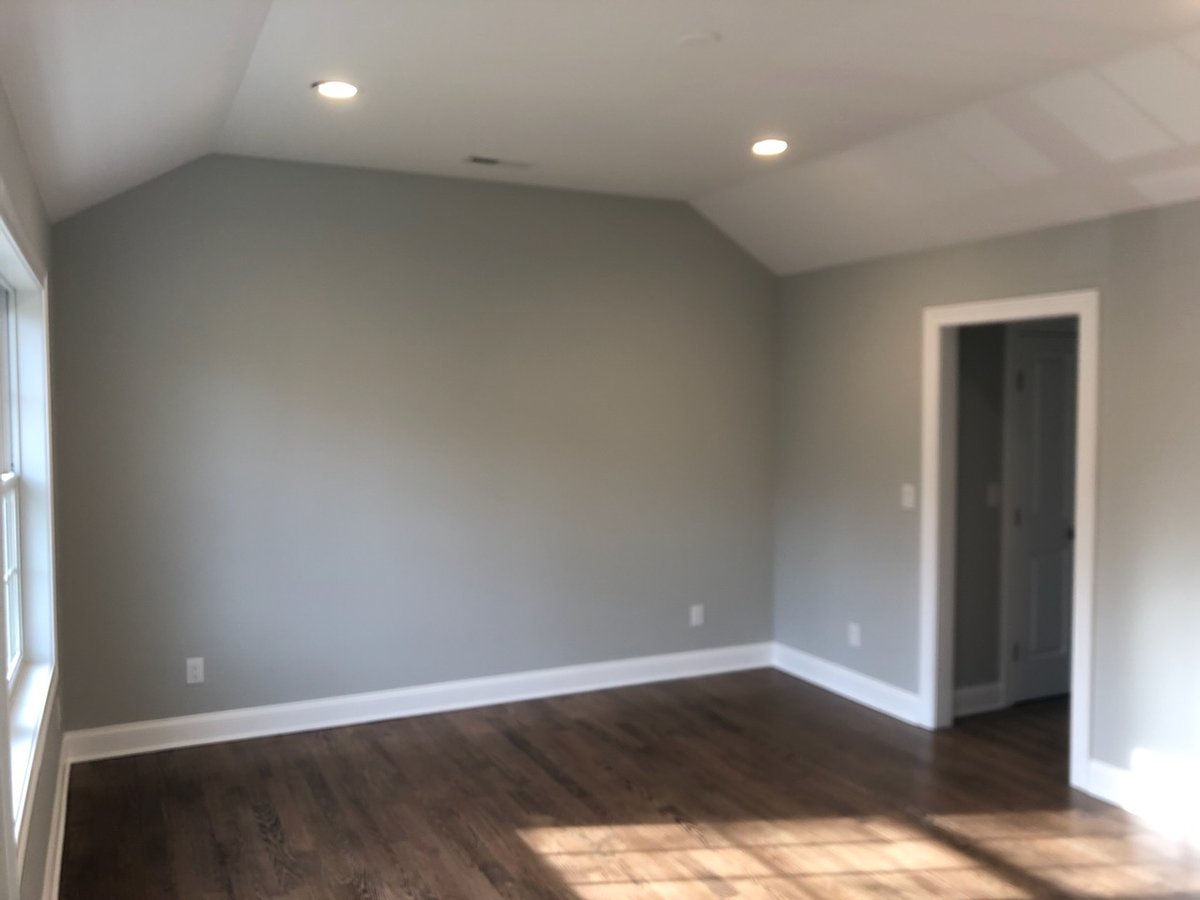Finished bedroom with vaulted ceiling in a custom home by Fairmount Heights Homes in Ridgewood, NJ.