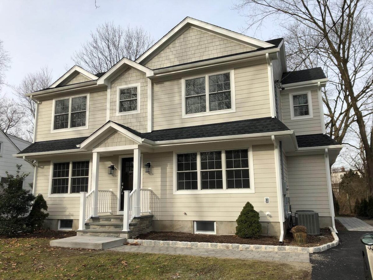 Front view of a two-story custom home in Ridgewood, NJ built by Fairmount Heights Homes.