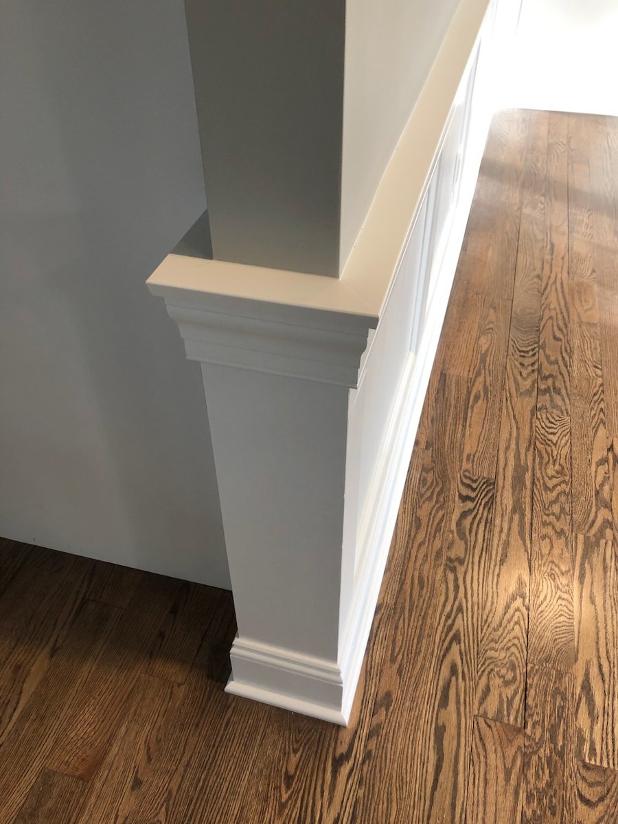 Interior column with decorative trim in a Ridgewood, NJ custom home by Fairmount Heights Homes.