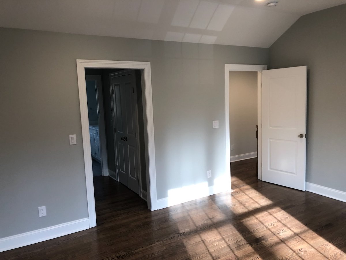 Master suite with open access to bathroom and hallway in Ridgewood, NJ custom home.