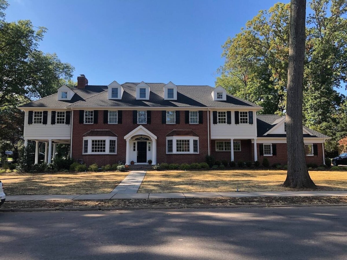 Street view of a large colonial-style custom home in Ridgewood, NJ by Fairmount Heights Homes.