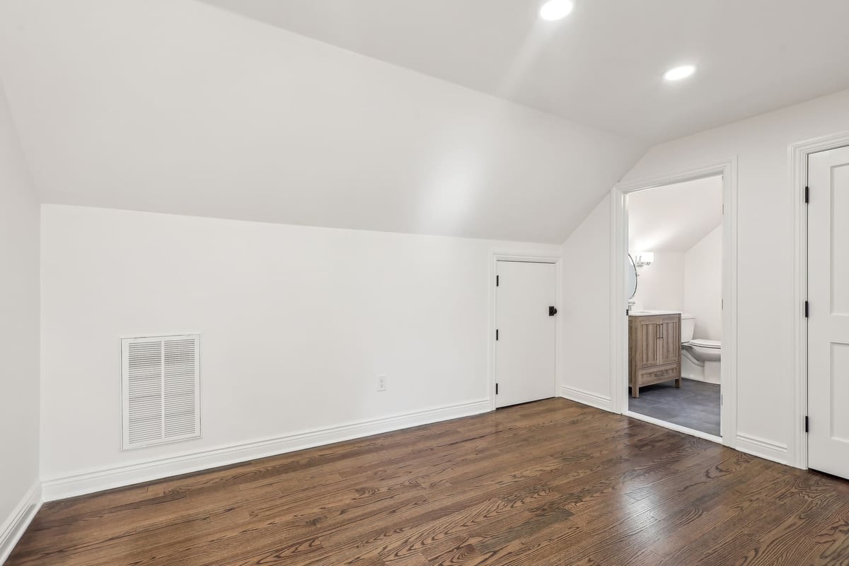 Bedroom in Ridgewood, NJ with sloped ceiling and en suite bath