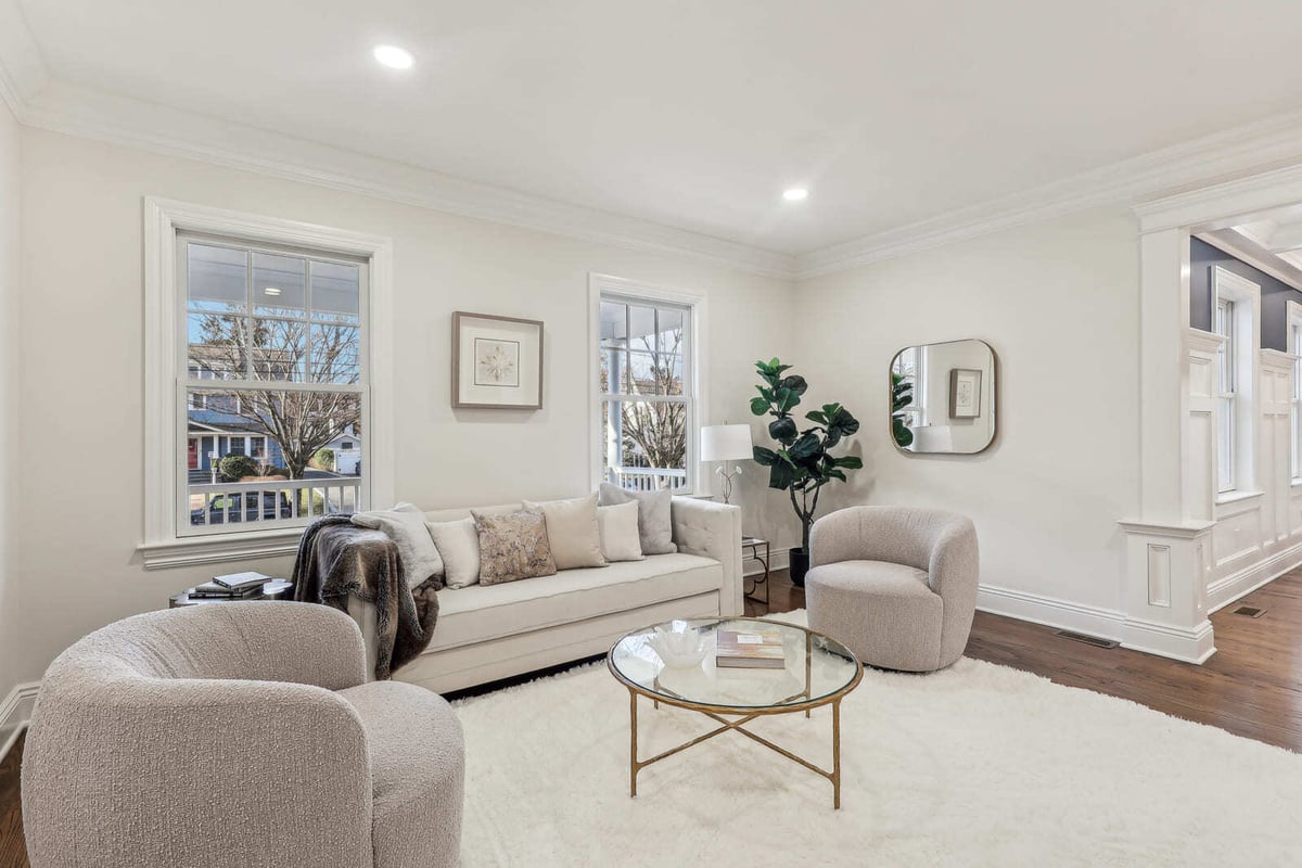 Bright neutral living room in Ridgewood, NJ with plush seating, large windows, and a cozy white rug