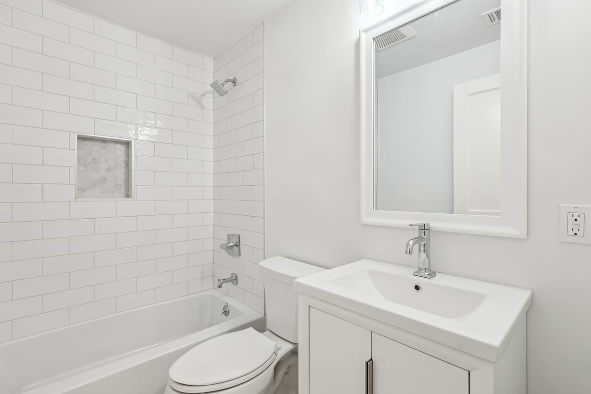Full bathroom in Ridgewood, NJ with white subway tile tub and shower